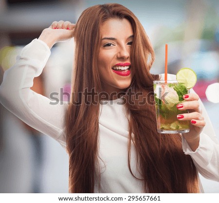 elegant woman drinking a mojito