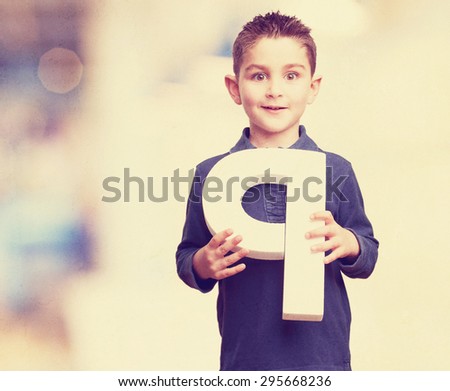 little kid holding the p letter