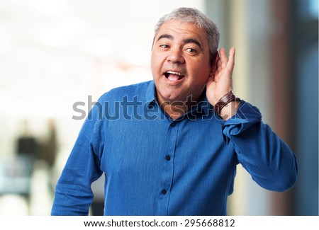 portrait of a mature man trying to hear something