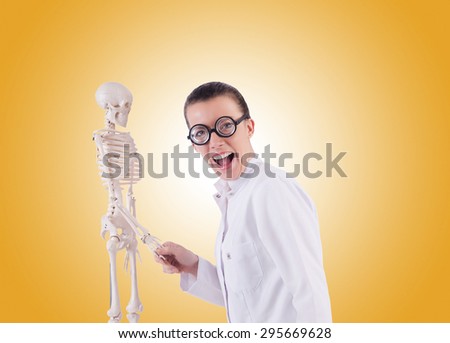 Doctor with skeleton against gradient 