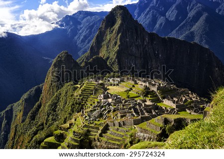 MACHU PICCHU, PERU - MAY 31, 2015: View of the ancient Inca City of Machu Picchu. The 15-th century Inca site.'Lost city of the Incas'. Ruins of the Machu Picchu sanctuary. UNESCO World Heritage site. Royalty-Free Stock Photo #295724324