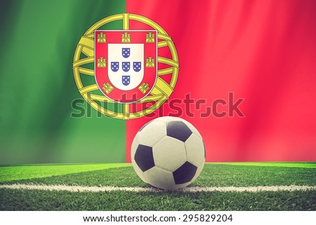 soccer ball in front of the Portugal flag vintage color