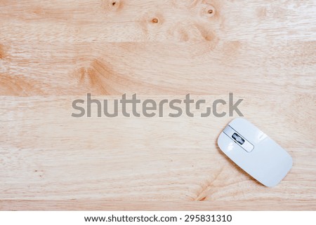 Keyboard and mouse on wooden table