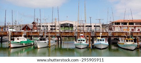Fishing boats mooring at Fisherman's Wharf, San Francisco, California. Royalty-Free Stock Photo #295905911