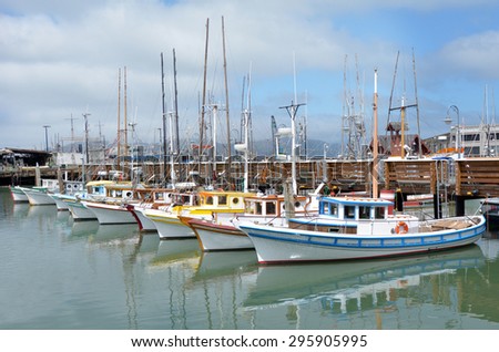 Colorful fishing boats in Fisherman's Wharf, San Francisco California, United States of America. No people. Copy space Royalty-Free Stock Photo #295905995