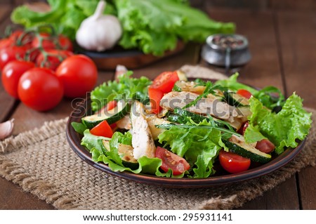 Salad of chicken breast with zucchini and cherry tomatoes Royalty-Free Stock Photo #295931141