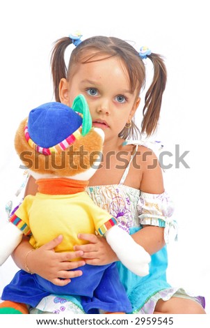 Girl holding and hugging a plush toy