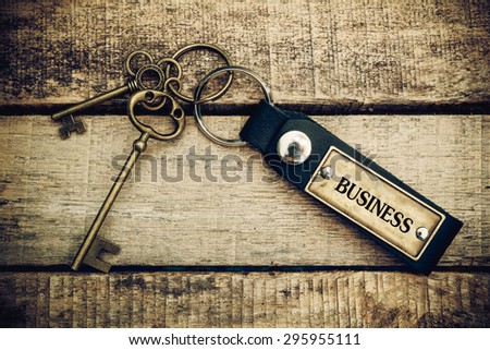 The concept of 'business" is translated by key and silver key chain.