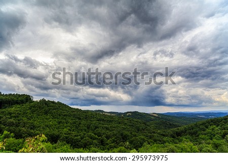 Dramatic clouds above a valley in the mountains