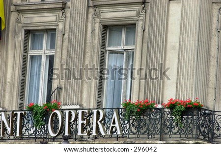 Low angle view of a sign mounted on a wrought iron balcony, Paris, France,