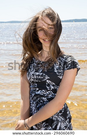 Pretty Young girl  refreshing at the ocean
