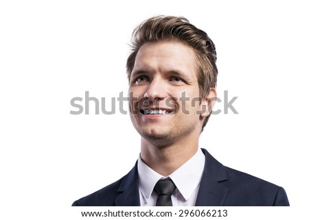Young handsome businessman. Studio shot on white background. 