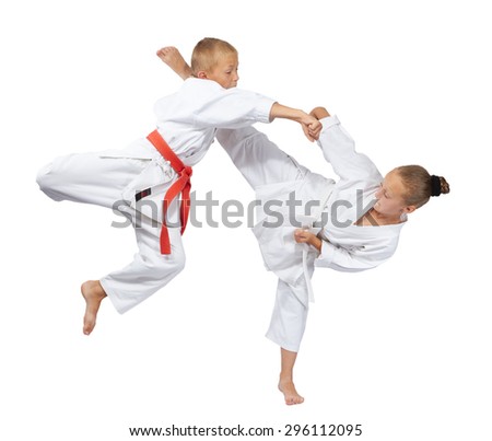 Kids beats mavashi geri and punch arm in the jump Royalty-Free Stock Photo #296112095