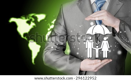 businessman protecting family 