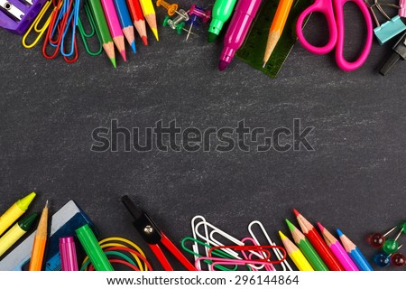 School supplies double border on a chalkboard background Royalty-Free Stock Photo #296144864