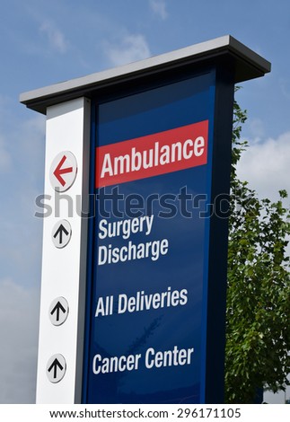 Hospital sign showing direction to medical service entrances
