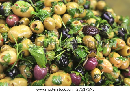olives heap on open market as background