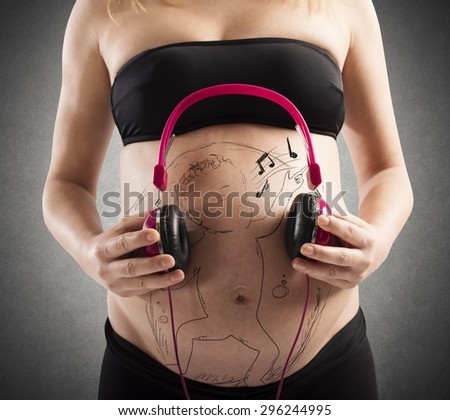 Baby in mother belly listening to music