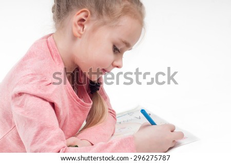 Smiling drawing little girl in pink and her painting