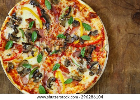 traditional Italian pizza with mushrooms, peppers and pancetta