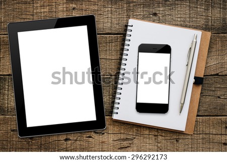 mockup tablet similar to ipad and phon on wood background