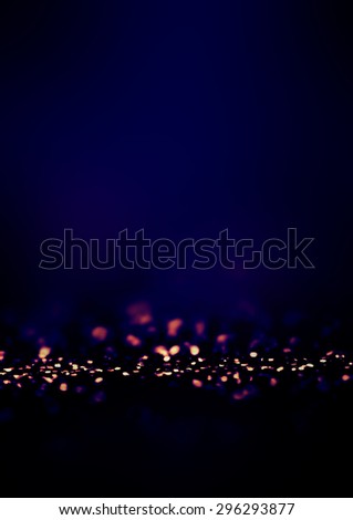 		Dark Blue Defocused Bokeh twinkling lights Vintage background. Festive Christmas elegant abstract background with bokeh