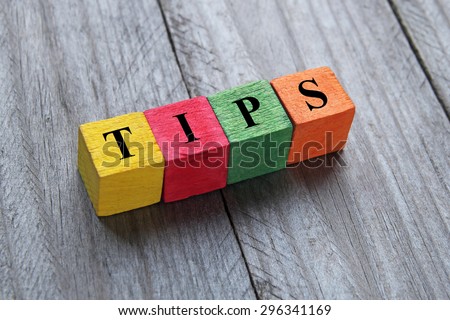 word tips on colorful wooden cubes Royalty-Free Stock Photo #296341169