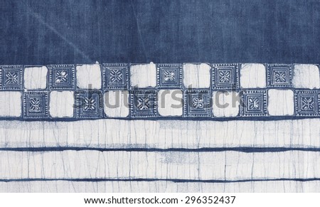indigo blue batik pattern on cotton fabric background.
