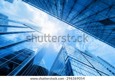 Common modern business skyscrapers, high-rise buildings, architecture raising to the sky, sun. Concepts of financial, economics, future etc. Royalty-Free Stock Photo #296369054