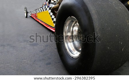 Dragster race car shot from back left tire Royalty-Free Stock Photo #296382395
