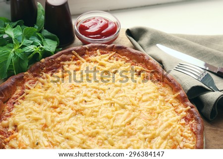 Tasty cheese pizza on table close up