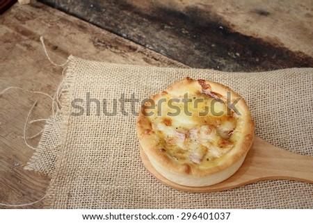 Crispy homemade Pizza on background of brown.