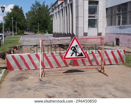 Road signs in a street under reconstruction