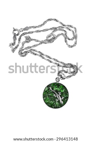 Emerald medallion with silver lizard on white background