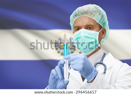 Doctor with syringe in hands and flag on background - El Salvador