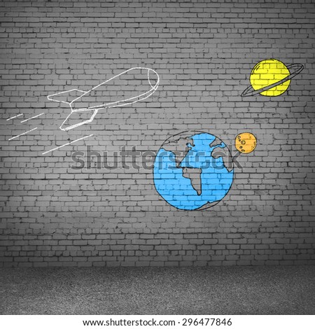 Background image with flying drawn rocket on cement wall
