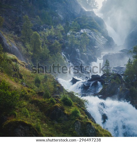 Beautiful vibrant panorama picture with a view on norwegian waterfall