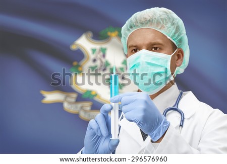 Doctor with syringe in hands and USA states flags on background - Connecticut