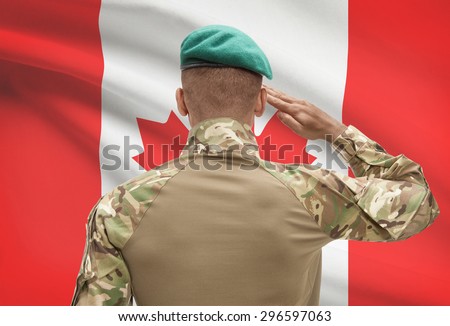 Dark-skinned soldier in hat facing national flag series - Canada