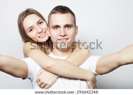 man taking a selfie with her girlfriend isolated on white background