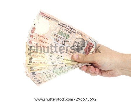Hand with Indian thousand rupee notes isolated Royalty-Free Stock Photo #296673692