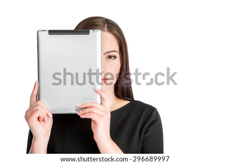 young  girl holding a tablet computer keeps the face  isolated on a white background.