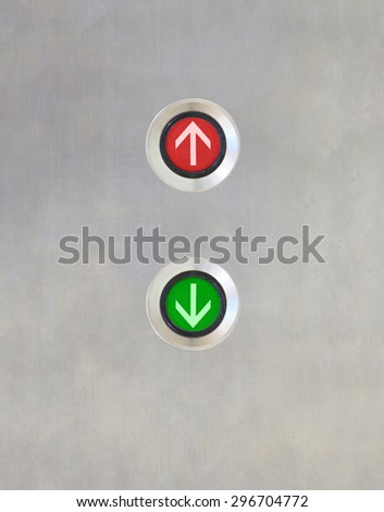 Elevator Button up red and down green light direction on stainless plate. Conflict concept.