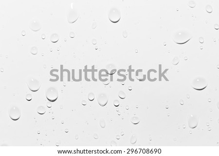 drops of water on white. close-up Royalty-Free Stock Photo #296708690