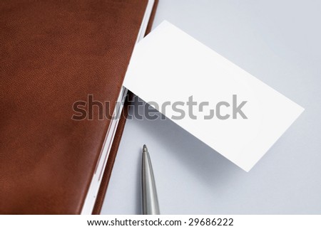 Empty business card with diary and pen