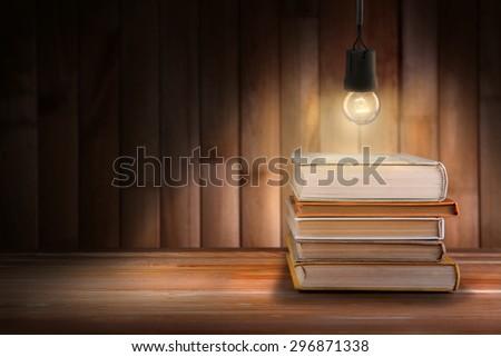 Lightbulb and books