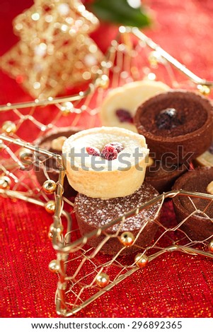 chocolate tartlets in festive golden red style, shallow dof