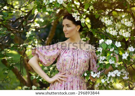 Young beautiful woman in the garden