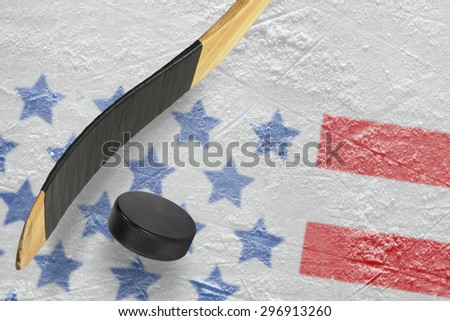 Hockey puck, stick and a fragment of an image of the American flag
