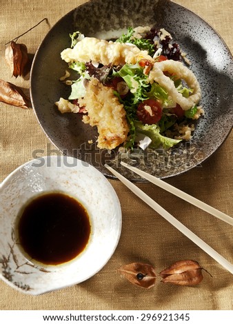 Tempura salad. Lettuce, shrimp, squid, octopus, sauce, vertical photo